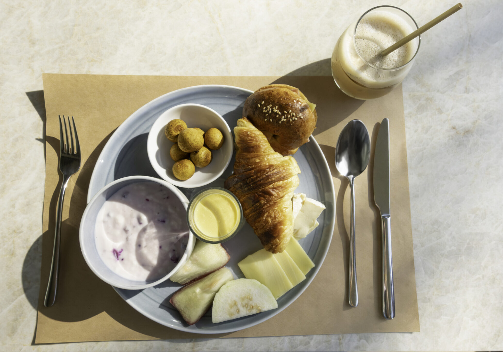 Hotel Breakfast Plate with Croissant, Fruit and Coffee