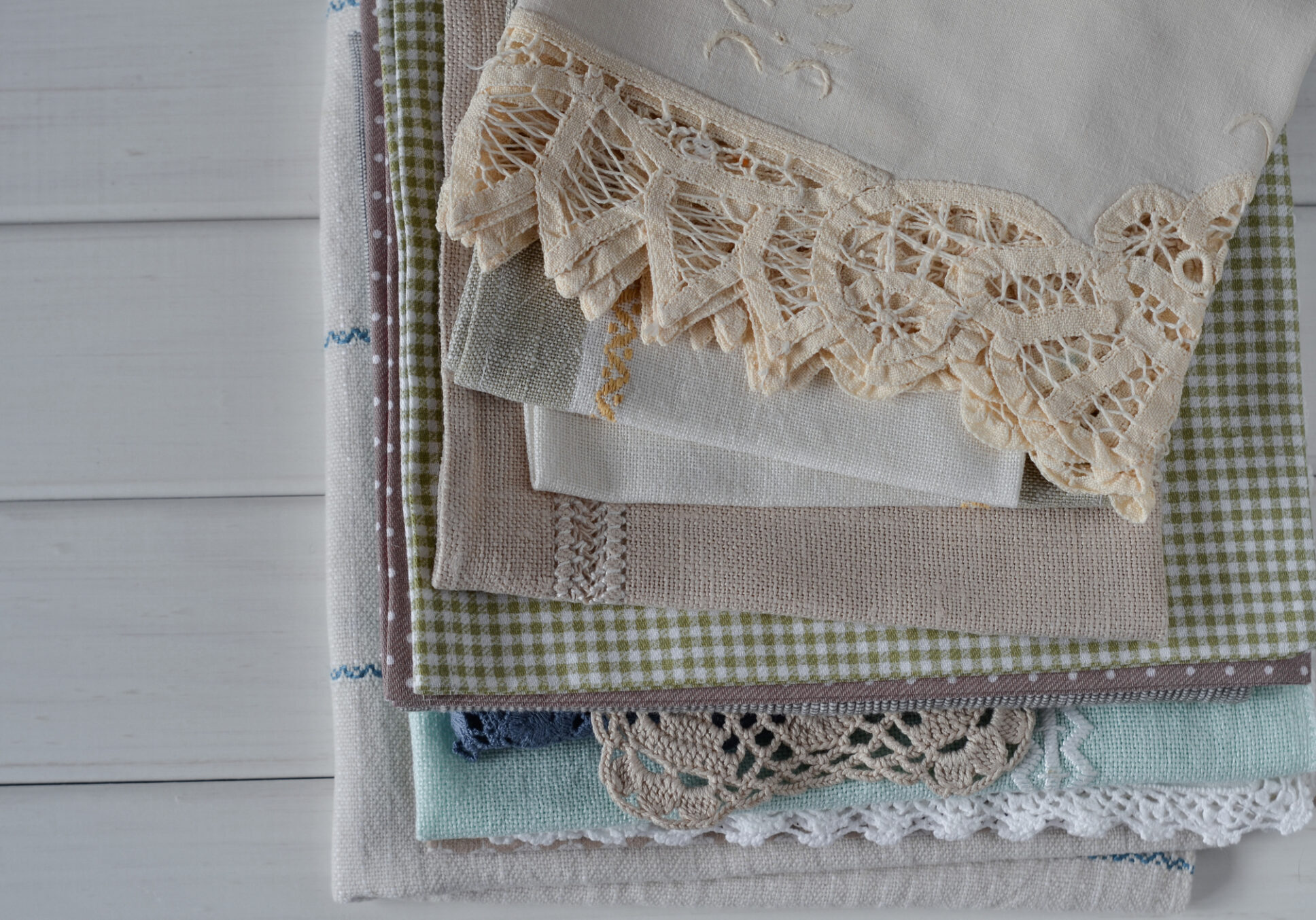 Pile of decorative cloths with lace trim