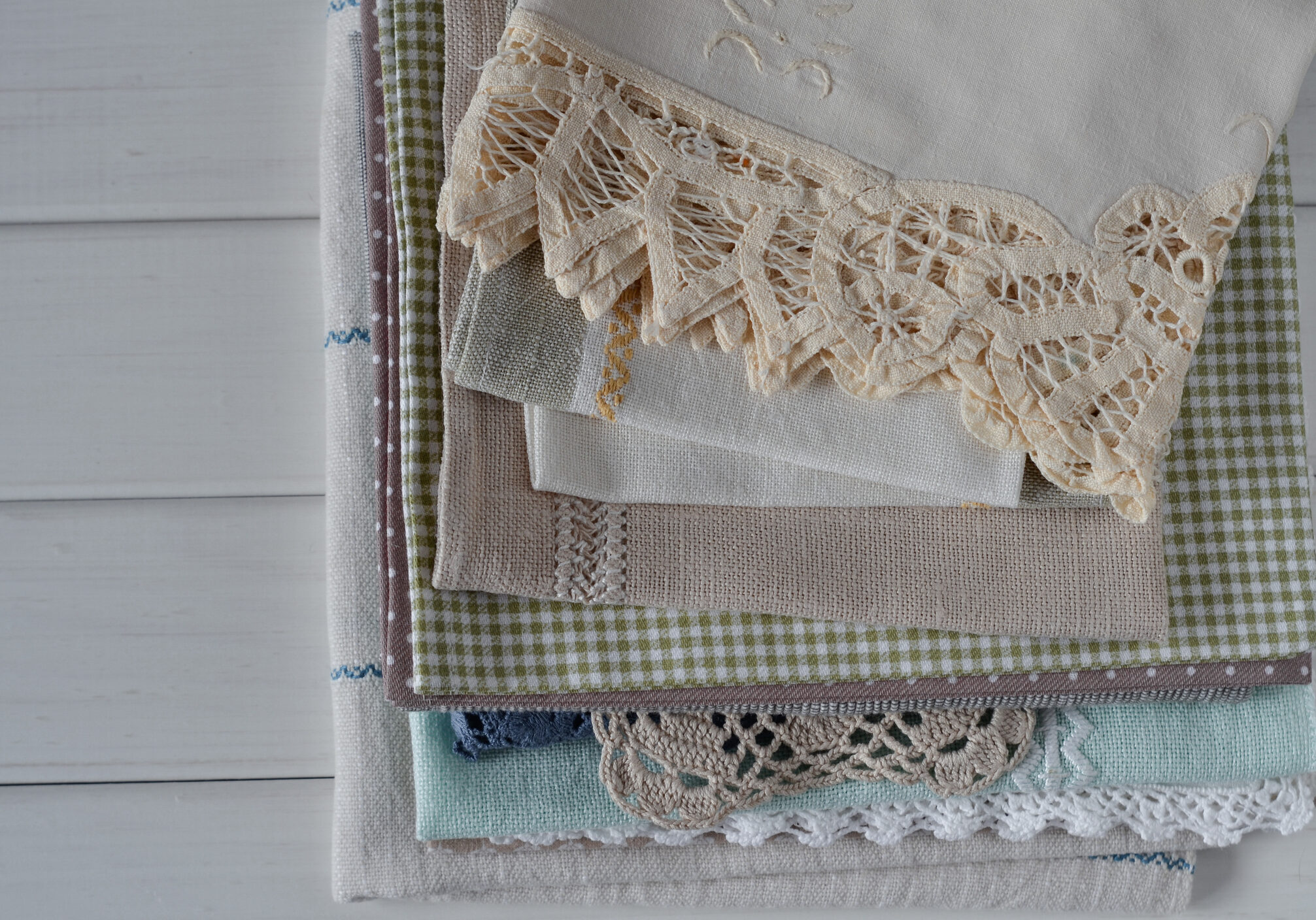 Pile of decorative cloths with lace trim